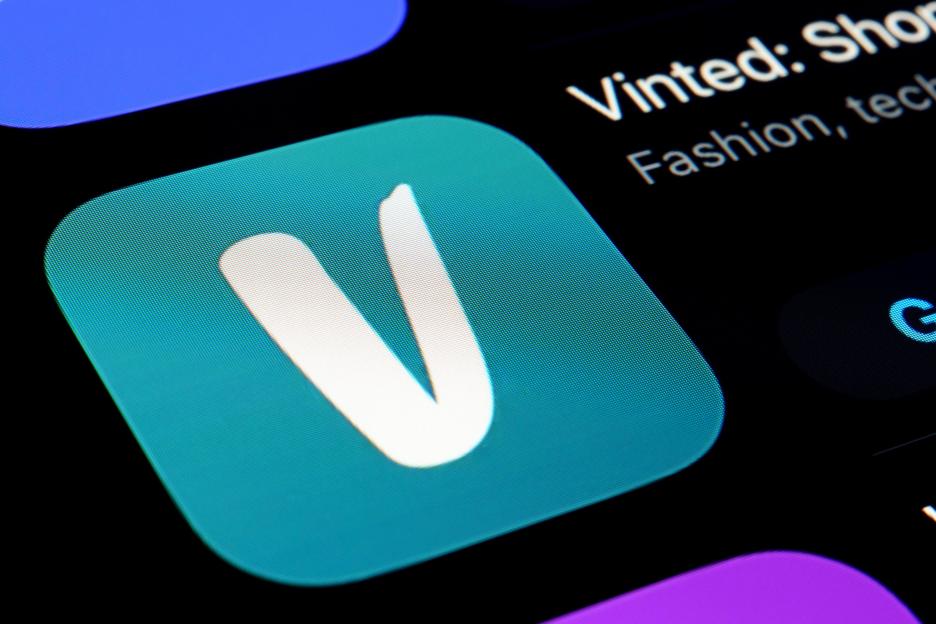 The Vinted app icon on a smartphone screen.