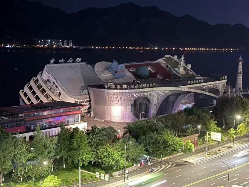 Luxury 'Floating Hotel' Cruise Ship Capsizes in 180mph Typhoon, Crashing into Dock and Causing $22M Damage