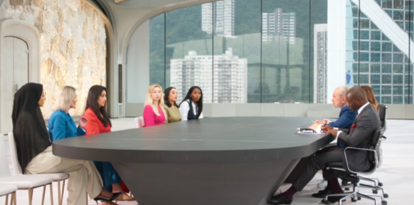 Seven women and two men sitting around a conference table.