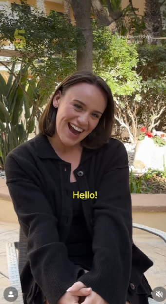 Ellie Leach smiling and greeting