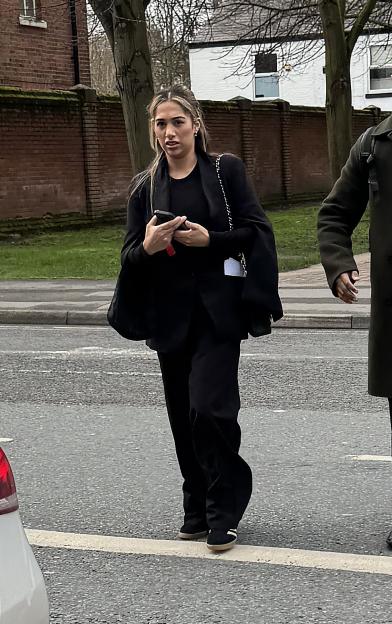 Sana Aslim, a beautician, walking on a street.