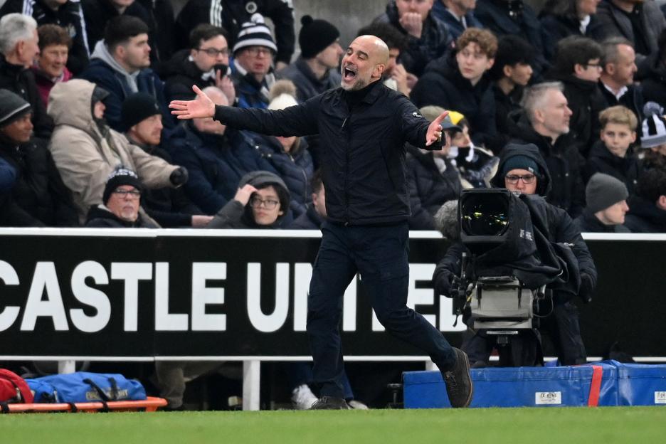 Manchester City head coach Pep Guardiola celebrates during a match against Newcastle United.