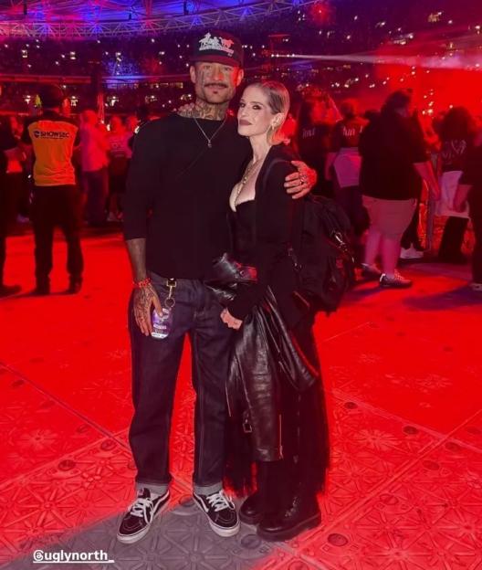 Kelly Osbourne with a mystery man at an event.