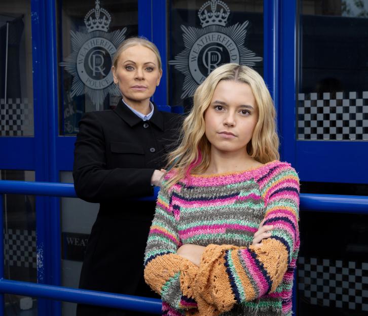 Lisa Swain and Betsy Swain in front of the Weatherfield Police station.