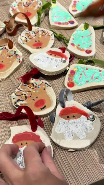 A collection of handmade salt dough ornaments shaped and decorated as Christmas characters and objects.