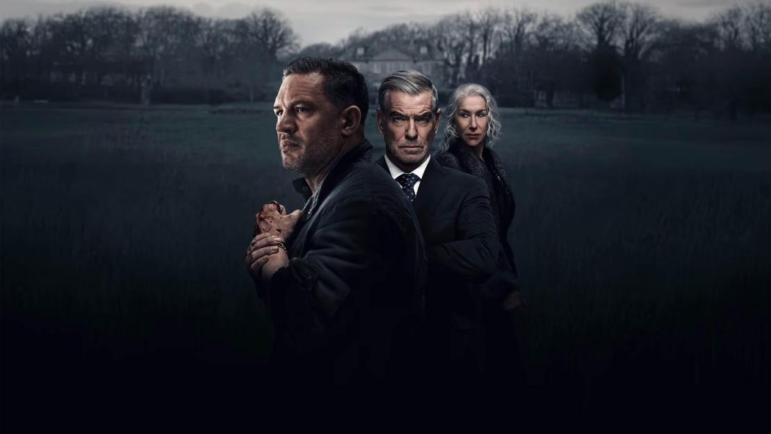 Three actors, Tom Hardy, Pierce Brosnan, and Helen Mirren, posing in a dark landscape.