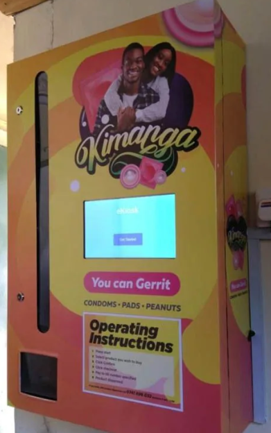 Kimanga eKiosk vending machine for condoms, pads, and peanuts.