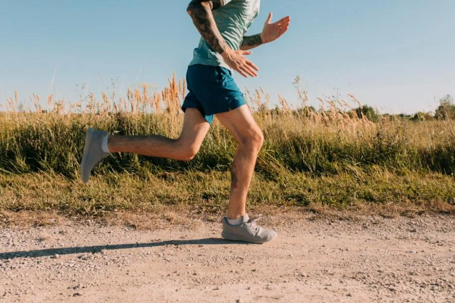 Anonymous Fit Man Running in the Countryside, Cardio Workouts Concept