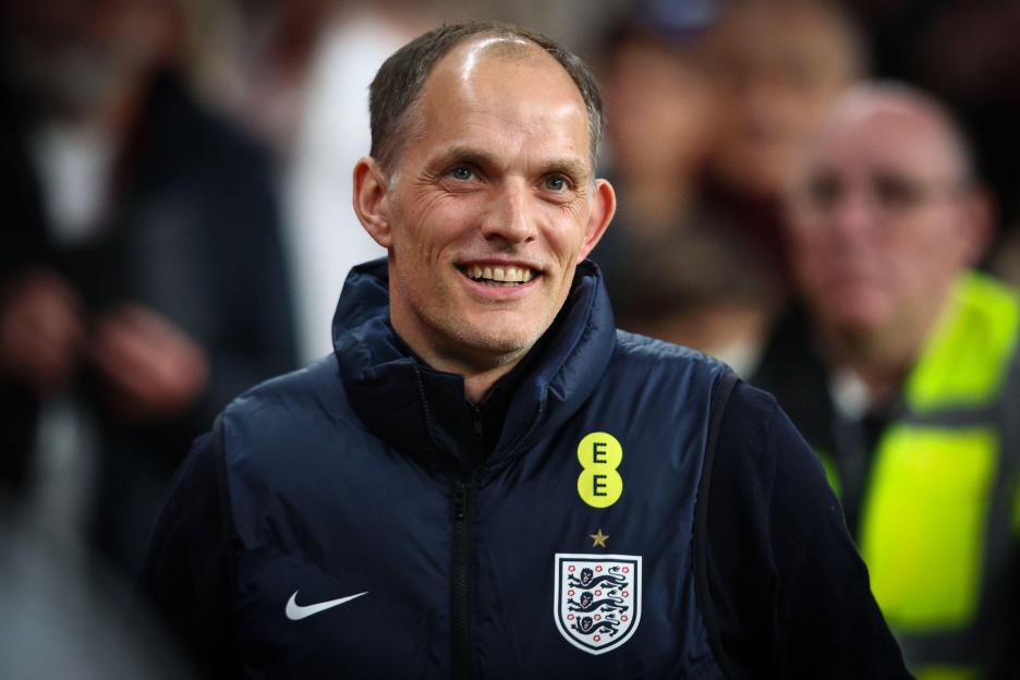 England Head Coach Thomas Tuchel smiling at Wembley Stadium.