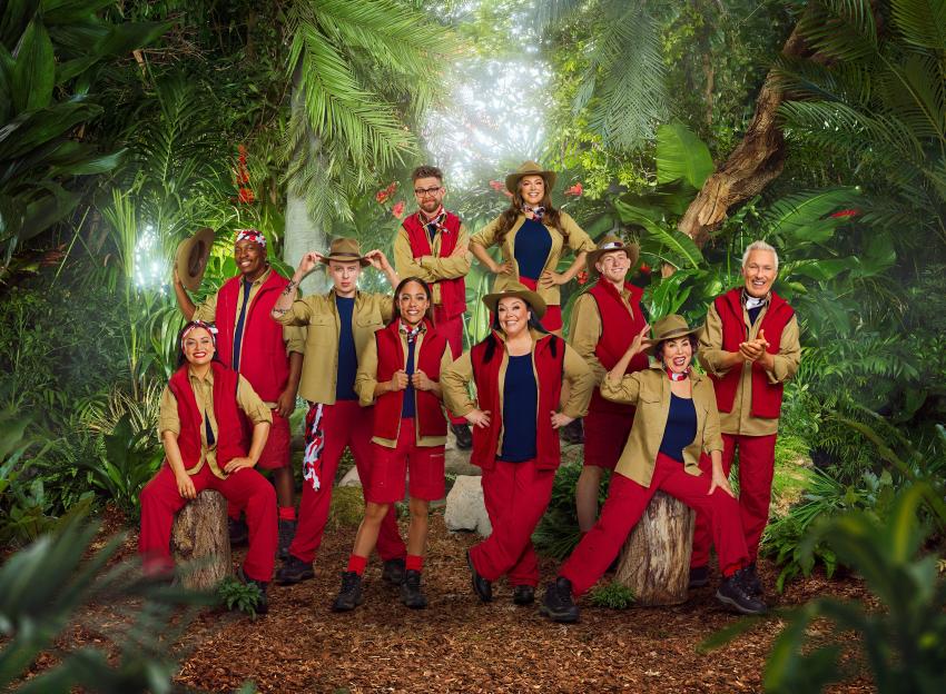 Shona McGarty, Eddie Kadi, Aitch, Alex Scott MBE, Jack Osbourne, Lisa Riley, Kelly Brook, Angry Ginge, Ruby Wax OBE, and Martin Kemp posing for "I'm a Celebrity... Get Me Out of Here!"