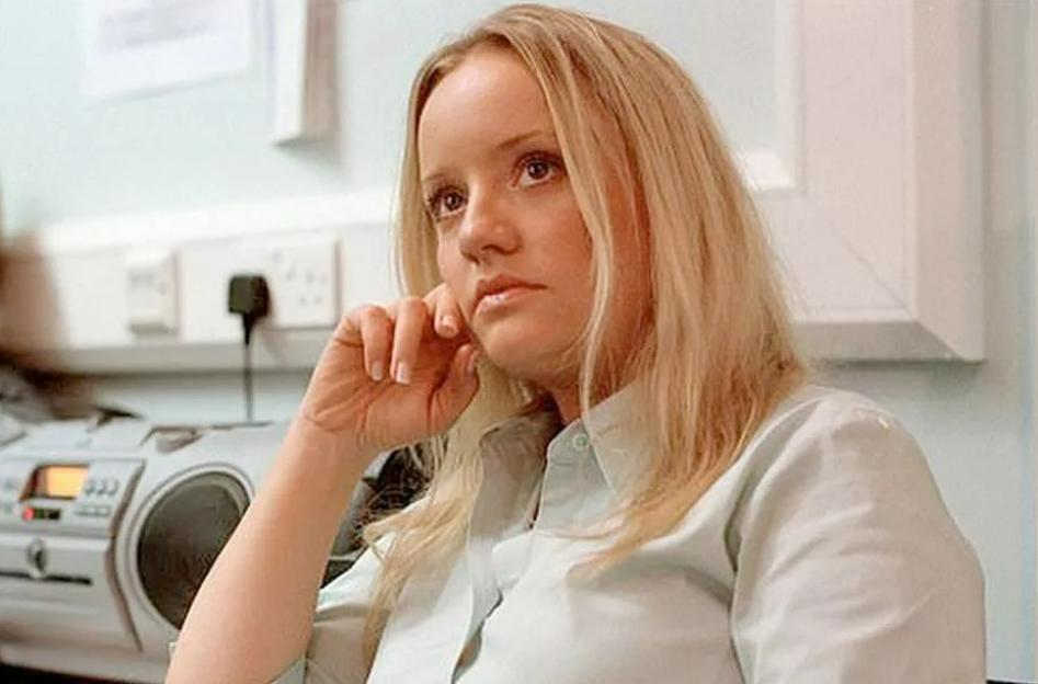 Lucy Davis in an office setting.