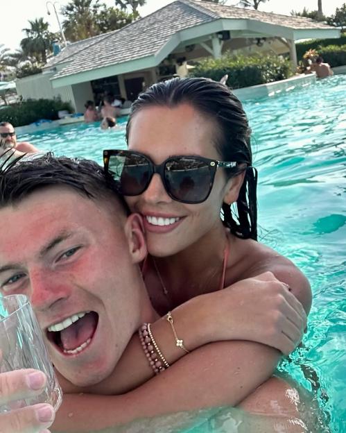 Gemma Owen and her new boyfriend embracing in a swimming pool.