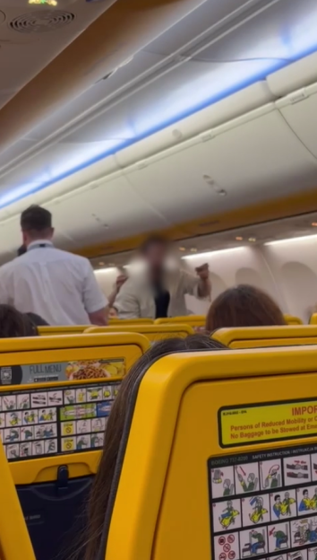 A blurred image of a passenger yelling on a Ryanair flight.
