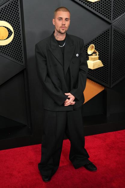 Justin Bieber poses on the red carpet at the 68th annual Grammy Awards.
