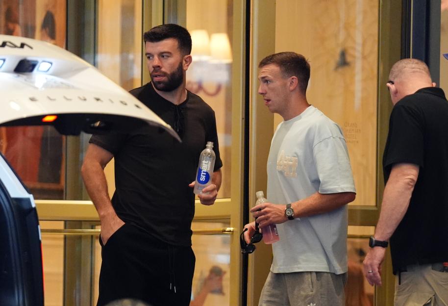 Scotland's Grant Hanley and Lewis Ferguson leaving their hotel in Charlotte, North Carolina after being eliminated from the 2026 World Cup.