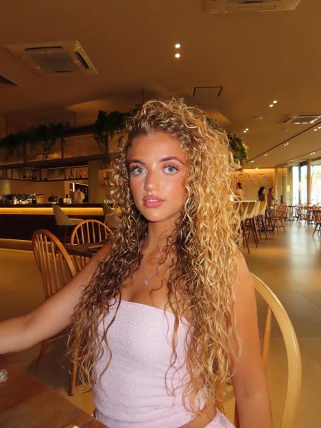 Princess Andre with long curly blonde hair.