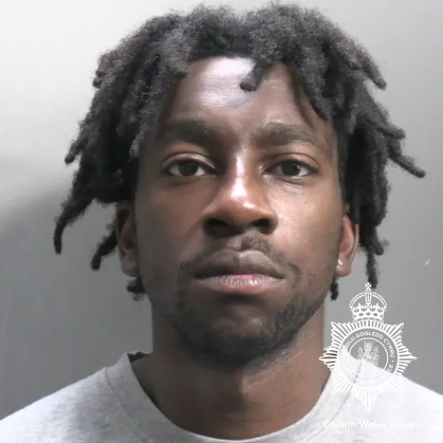 Mugshot of Nigerian rapist Gift Oladele.