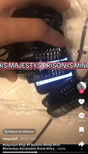 A hand holding a package containing several mobile phones, captured from a video with social media interface elements.