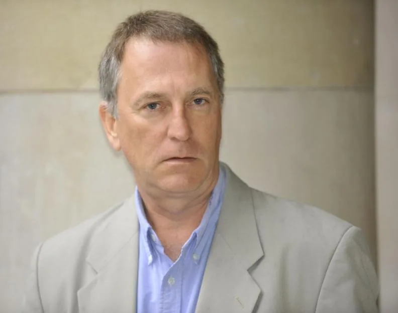 Mark Doyle, BBC World Affairs Correspondent, wearing a light-colored suit jacket and blue button-down shirt.
