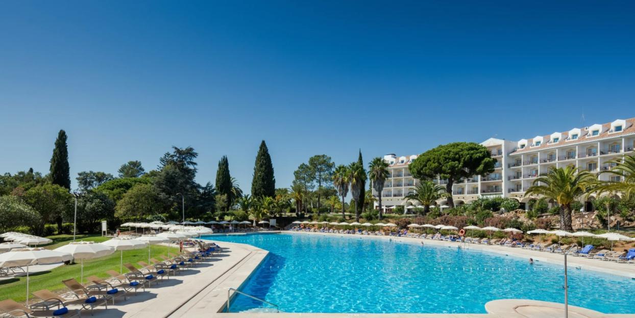 Penina Golf Resort swimming pool with hotel in the background.