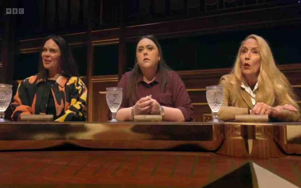 Joanne McNally, Sharon Rooney, and Jerry Hall seated at the round table on Celebrity Traitors.