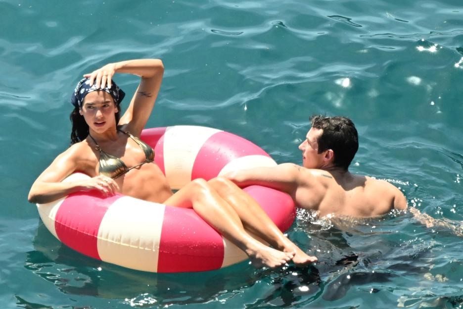 *PREMIUM-EXCLUSIVE* MUST CALL FOR PRICING BEFORE USAGE - Newlyweds Dua Lipa and Callum Turner looked every inch the loved-up couple as they soaked up the sunshine on the stunning Amalfi Coast during their romantic Italian honeymoon.