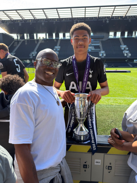 Martain and Phoenix Offiah smiling with the U16 Premier League Cup.