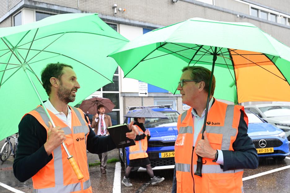 Alan Milburn and Gareth Southgate under green umbrellas during a Neets trip in Holland.