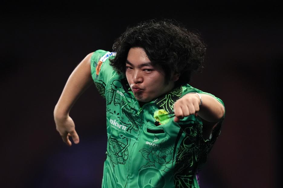 Motomu Sakai reacts during his darts match against Thibault Tricole.