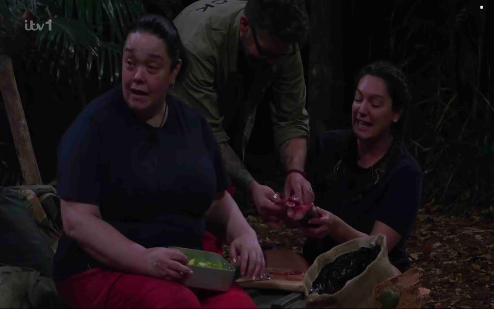 Lisa Riley and Kelly Brook eating eel for dinner in the I'm A Celebrity... Get Me Out Of Here! camp.