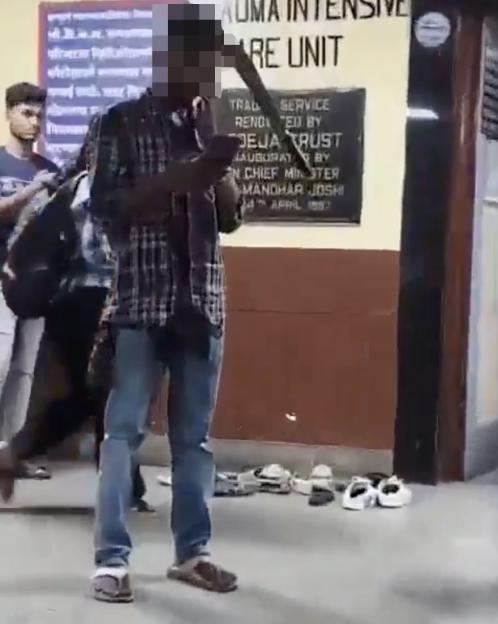 VIDEO: Man calmly waits in hospital with machete lodged in head