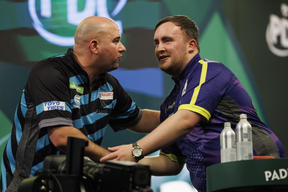 Luke Littler celebrates winning against Rob Cross in the semi-final match of the Paddy Power World Darts Championship.