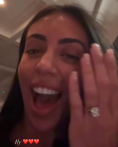 A woman, "sophiehabboo," showing off a large diamond engagement ring on her left hand, with a surprised and excited expression.