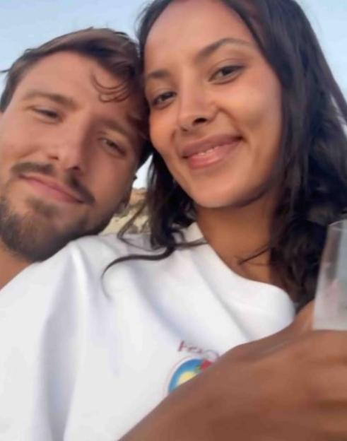 Maya Jama and Ruben smiling for a selfie.