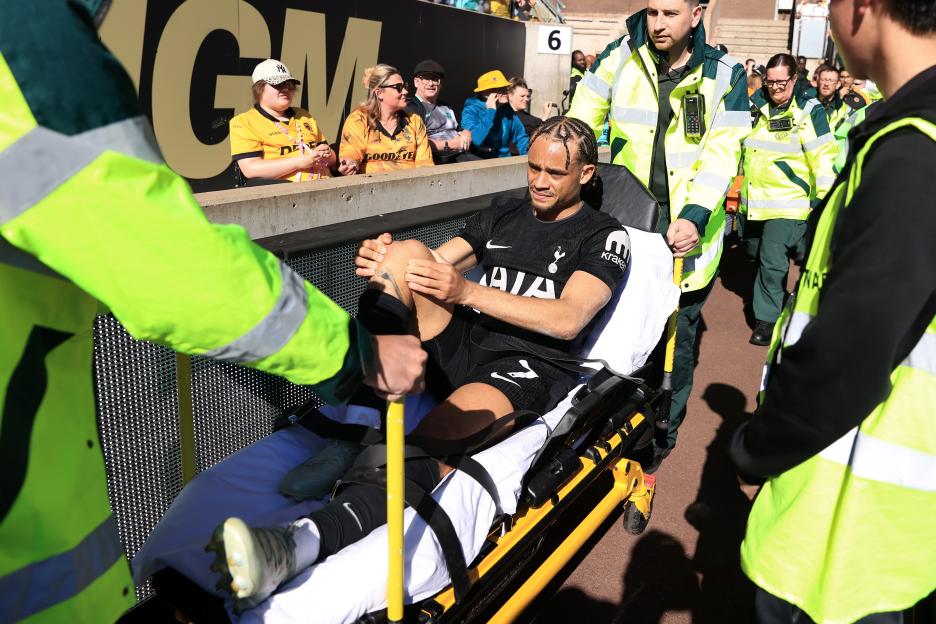 Xavi Simons of Tottenham Hotspur is taken away injured on a stretcher.