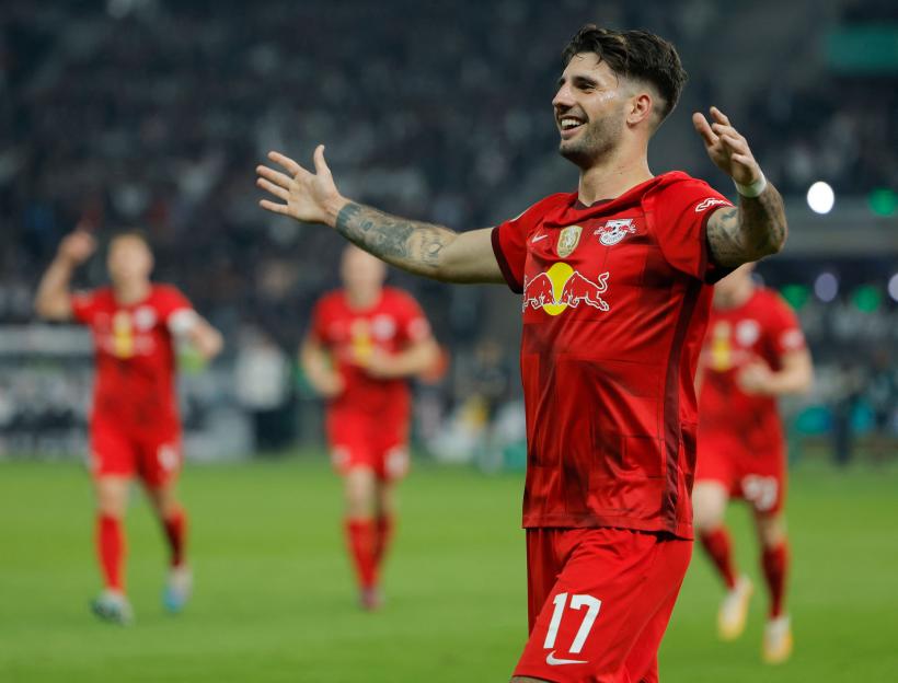 RB Leipzig midfielder Dominik Szoboszlai celebrates scoring during a football match.