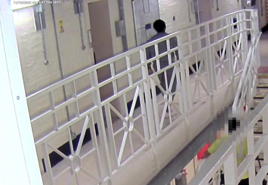 CCTV image showing Rico Gedel walking away from Ian Watkins' cell.