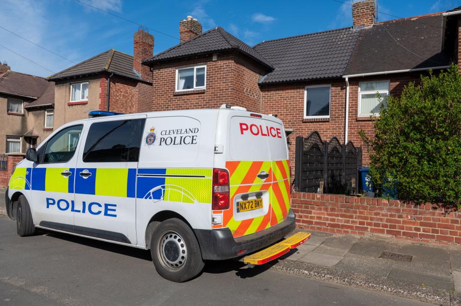 Cleveland Police van parked on a residential street.
