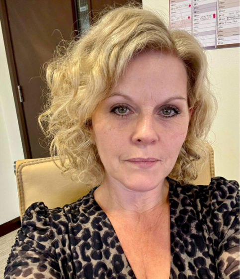 A headshot of Janine Dutton.