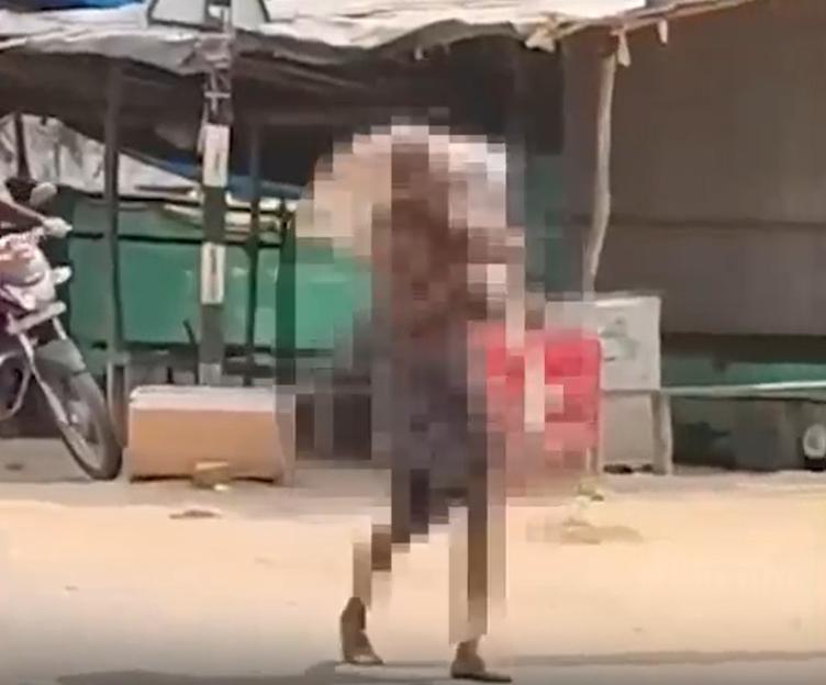 A pixelated image of a man carrying his dead sister's skeleton to a local bank branch.