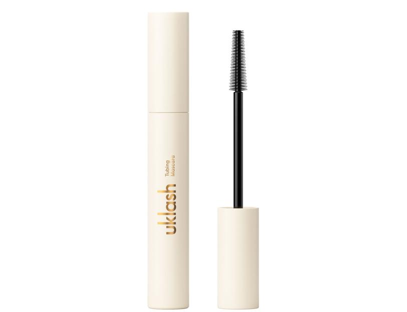 UKLASH Tubing Mascara, a light beige tube with the lid open revealing the mascara brush.