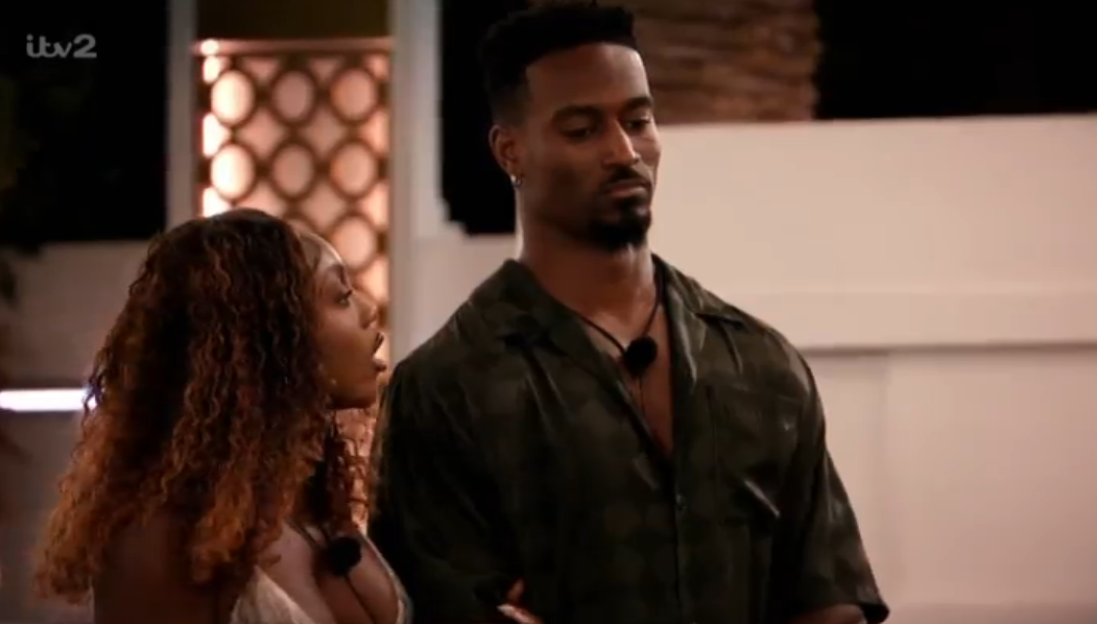 A man and a woman in an indoor setting.