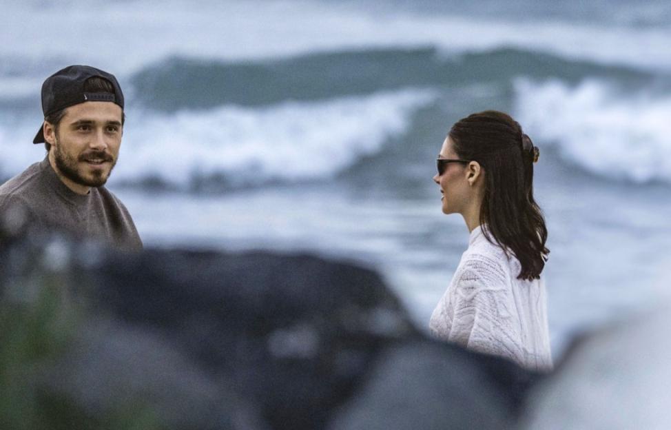 Brooklyn Beckham and Nicola Peltz Beckham by the ocean.