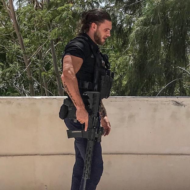 Grant Gale holding an M4-22 style rifle.