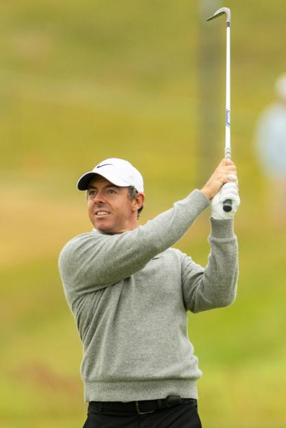Southhampton, United States. 18th June, 2026. Rory McIlroy of Northern Ireland hits an approach shot on the 1st hole during the first round of the 126th U.S. Open Golf Championship at Shinnecock Hills Golf Club in Southampton, NY, on Thursday, June 1