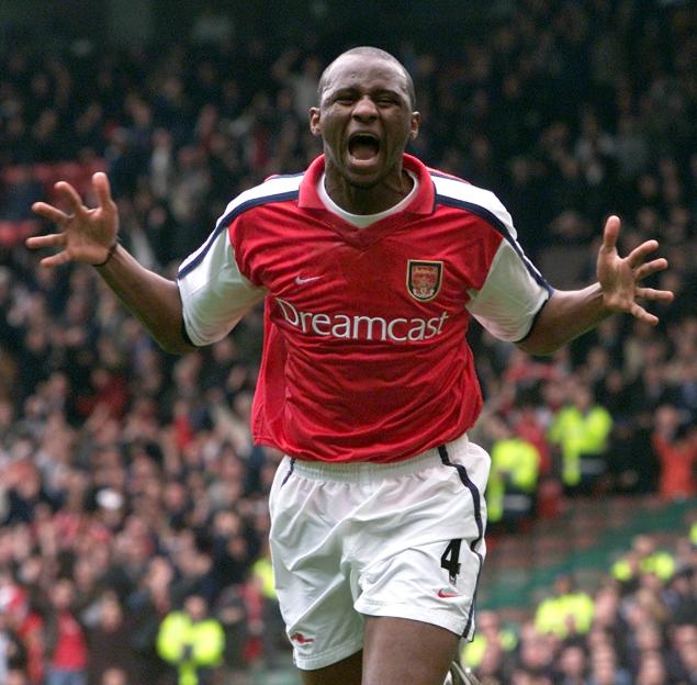 Arsenal's Patrick Vieira celebrates scoring a goal against Tottenham.