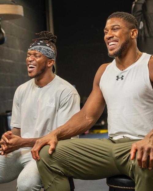 KSI and Anthony Joshua laughing together.