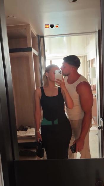 Molly Mae and Tommy Fury posing for a mirror selfie during their Athens holiday.