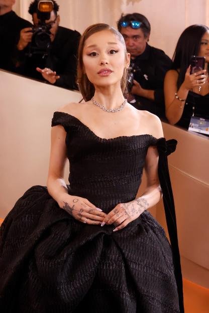 Ariana Grande in a black Vivienne Westwood gown and diamond necklace at the 83rd Annual Golden Globe Awards.