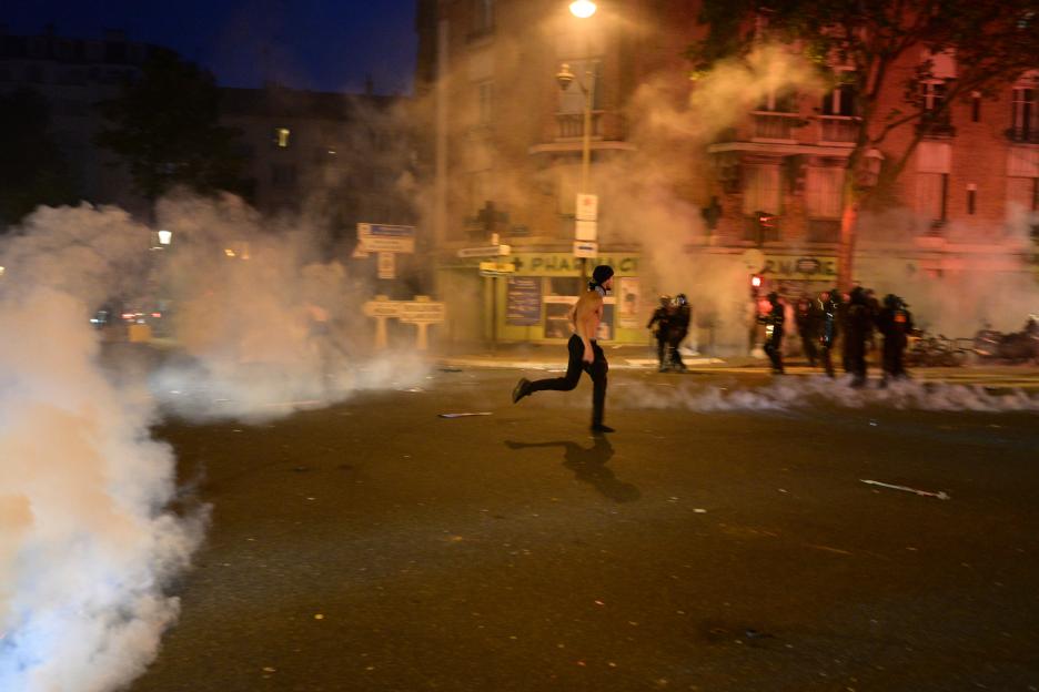 Paris Saint-Germain supporters celebrate their team's championship title in Paris